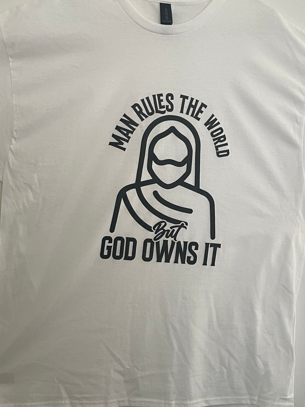 Man Rules the World But God Owns It T-Shirt
